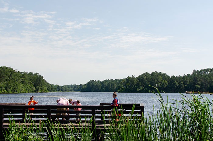 four people fishing at Lake Rim Park in Cumberland County
